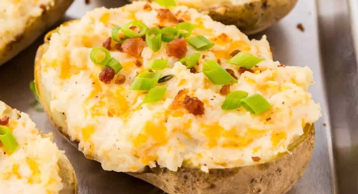 Up close image of twice baked potatoes with toppings.