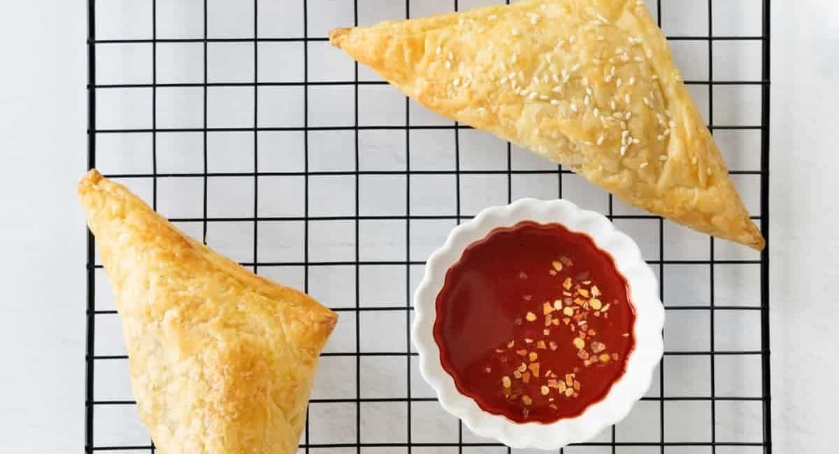 Overhead image of vegetable curry puffs with puff pastry.