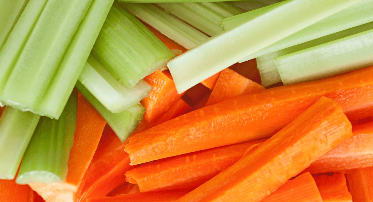 Overhead image of celery and carrot sticks.