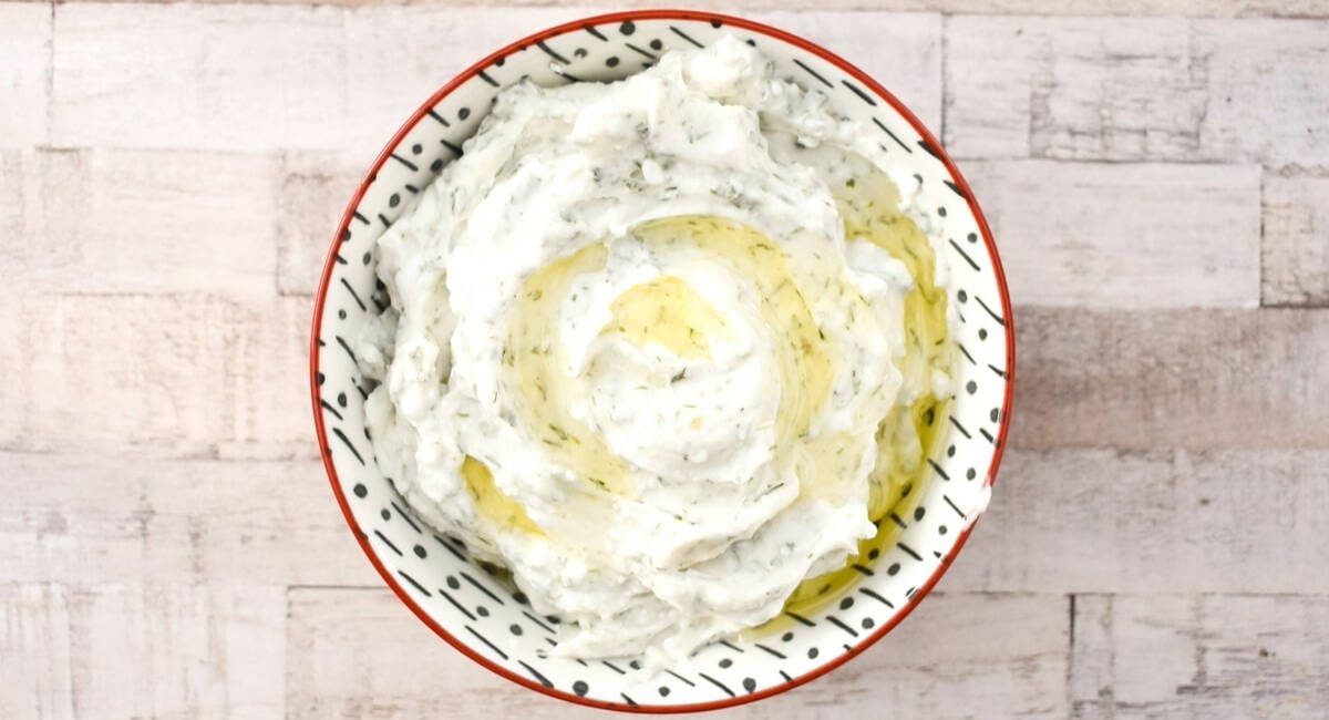 Overhead image of whipped feta with lemon herbs.