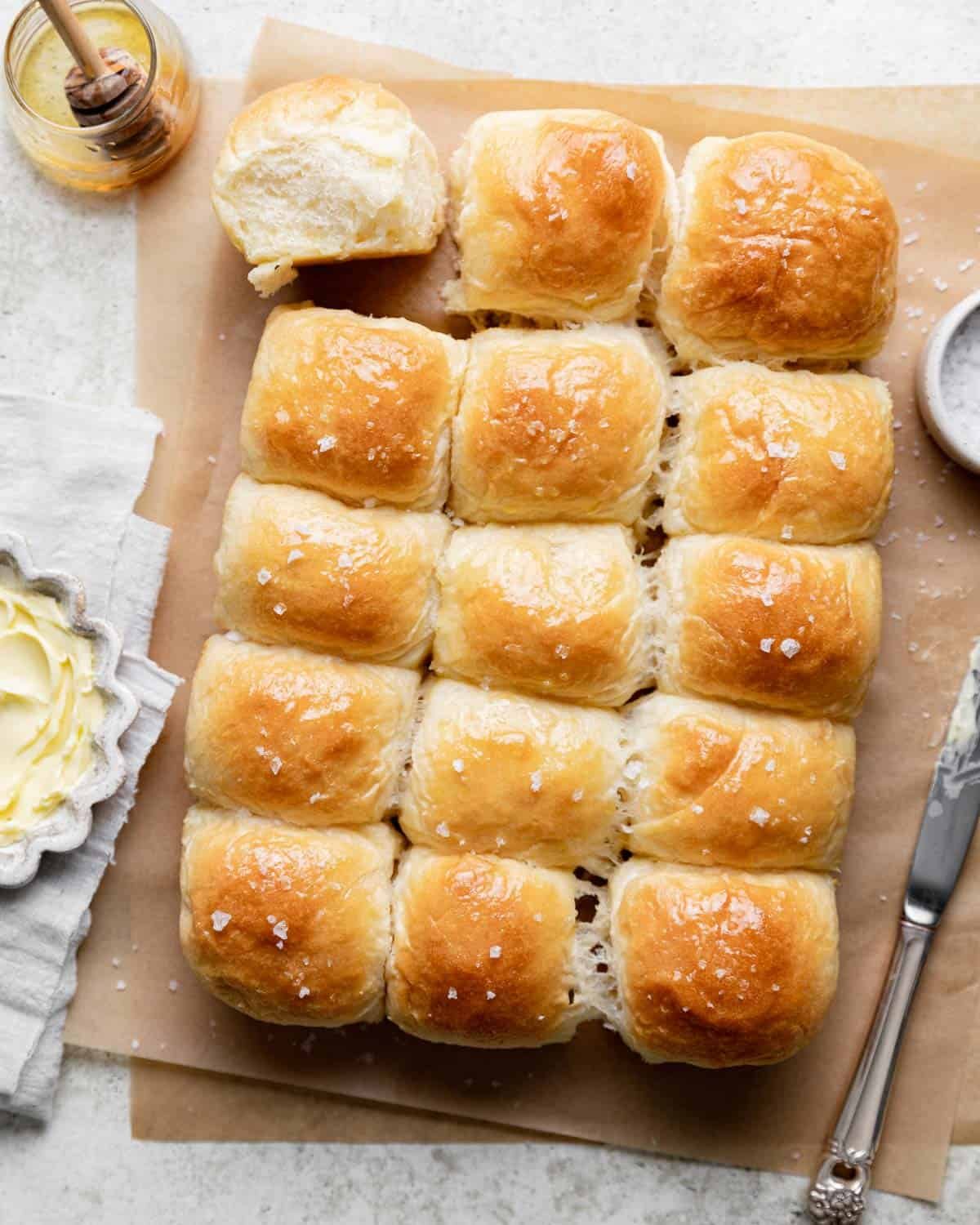 Old Fashioned Yeast Rolls on parchment paper.