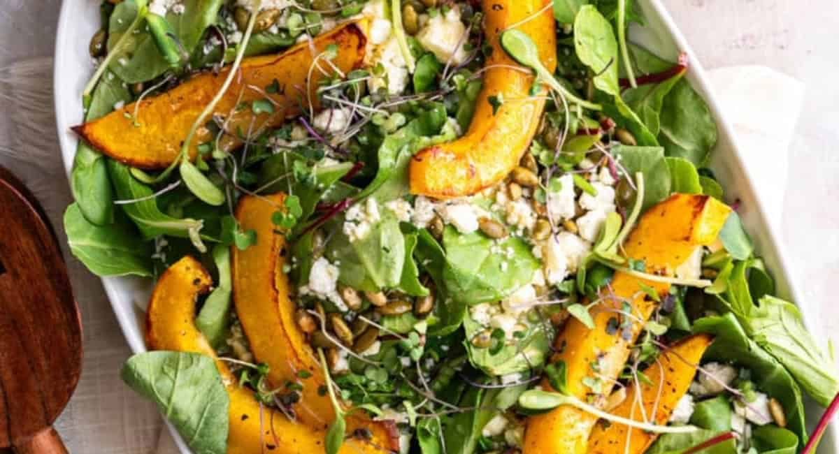 Overhead image of roast pumpkin salad on whtie dish.