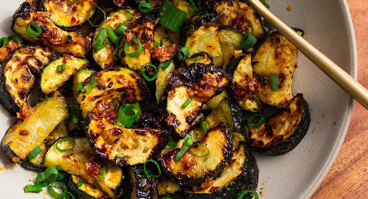 Overhead image of air fryer honey garlic zucchini.