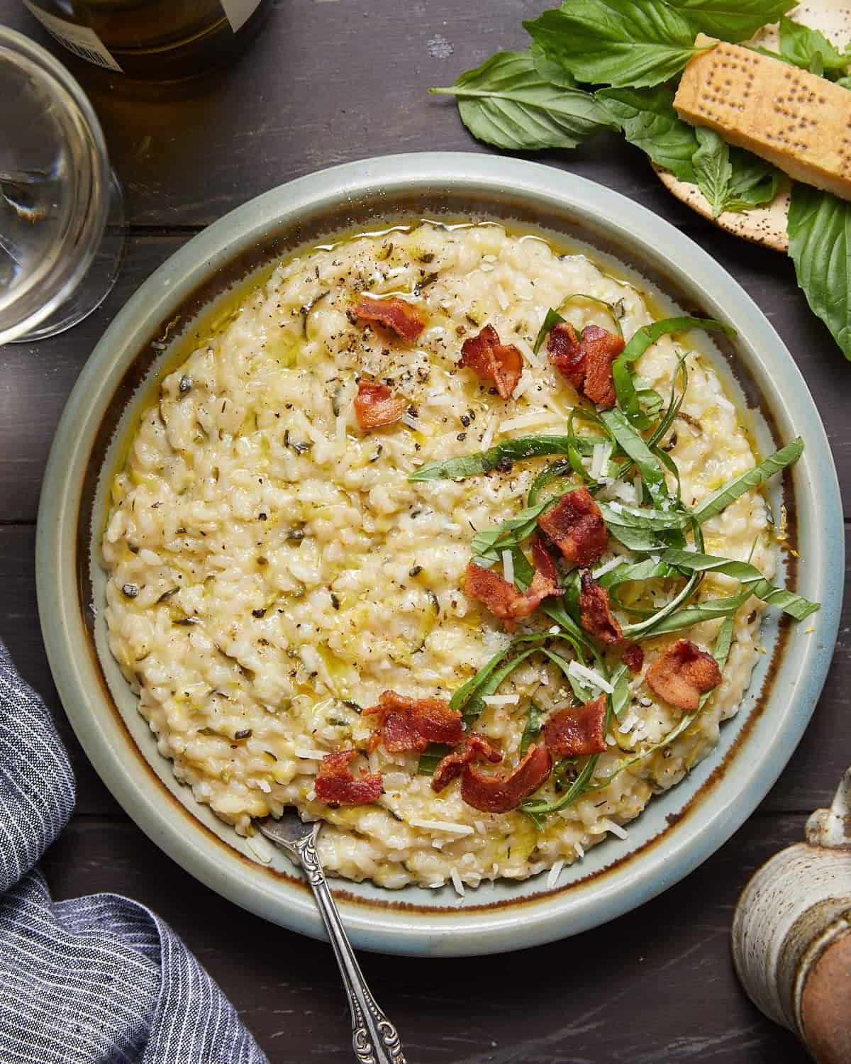 Overhead image of zucchini risotto with garnish.