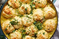 Rustic Dutch Oven Chicken Pot Pie with Fluffy Biscuit Topping
