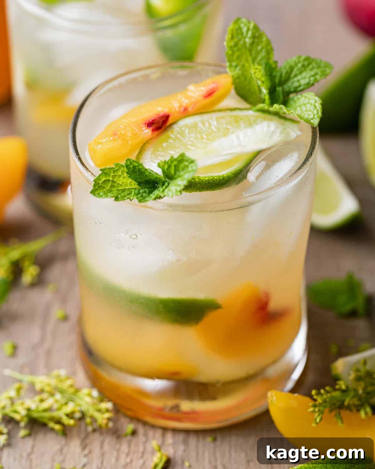 Sun-Kissed Peach Mule 6 A close-up shot of a Peach Moscow Mule, showing condensation on the copper mug and garnished with fresh peach slices and mint.
