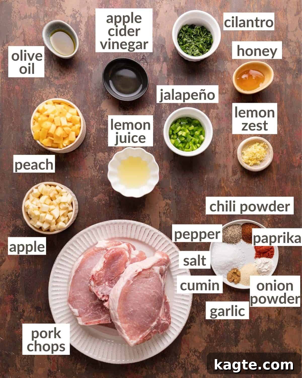 Overhead view of all fresh ingredients laid out for air fryer pork chops and apple peach salsa.
