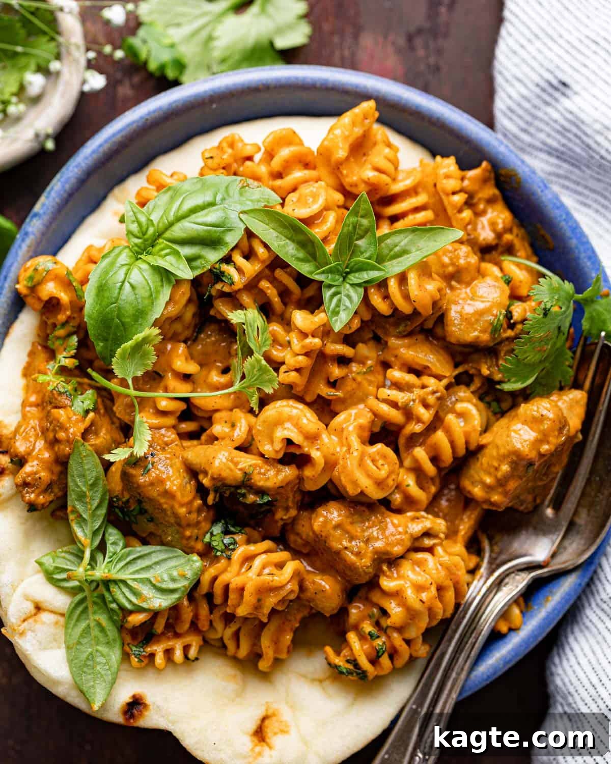 Up close image of butter chicken pasta with garnish.