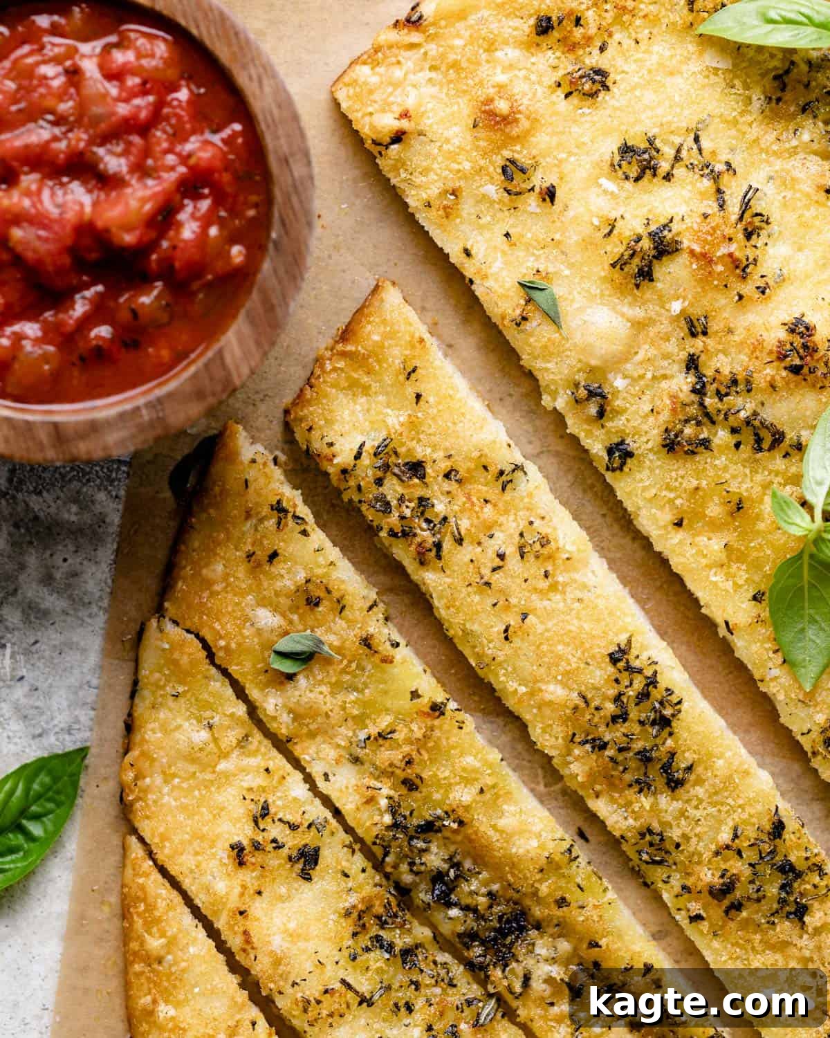 Up close photo of garlic herb breadsticks.