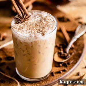 close-up of a chai tea latte with whipped cream and cinnamon
