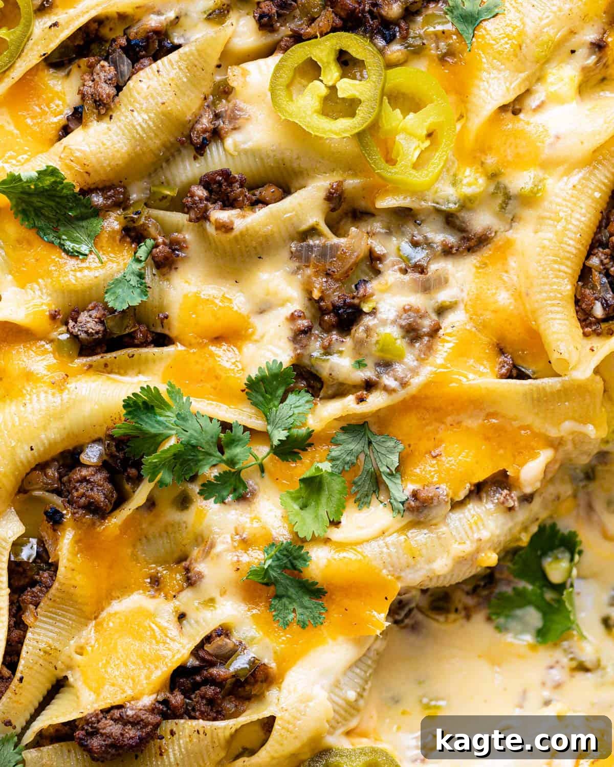 Loaded Philly Cheesesteak Shells 8 Up close image of Philly cheesesteak stuffed shells with ground beef.