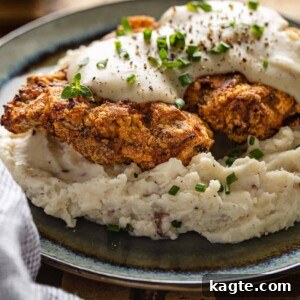 Crispy Air Fryer Chicken Fried Steak 11 Air Fryer Chicken Fried Steak served on a plate with gravy.