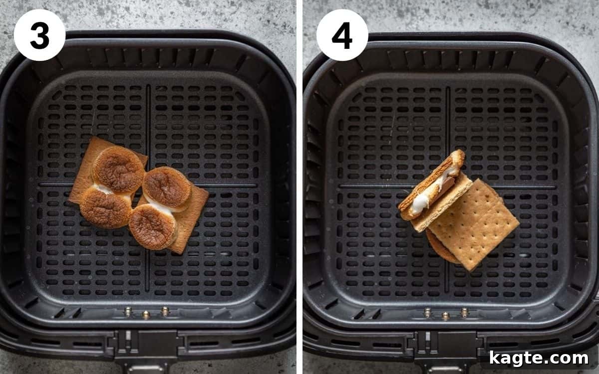 Gooey Air Fryer S'mores 5 Two finished Air Fryer S'mores in the air fryer basket, with perfectly melted chocolate and toasted marshmallows.