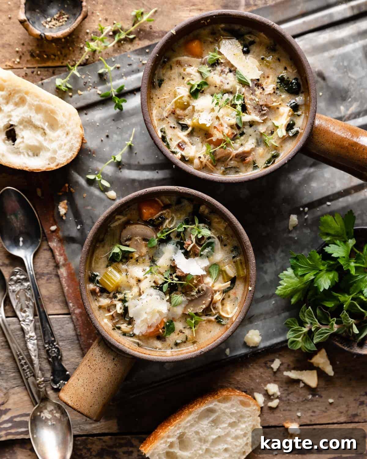 overhead of 2 soup bowls and bread