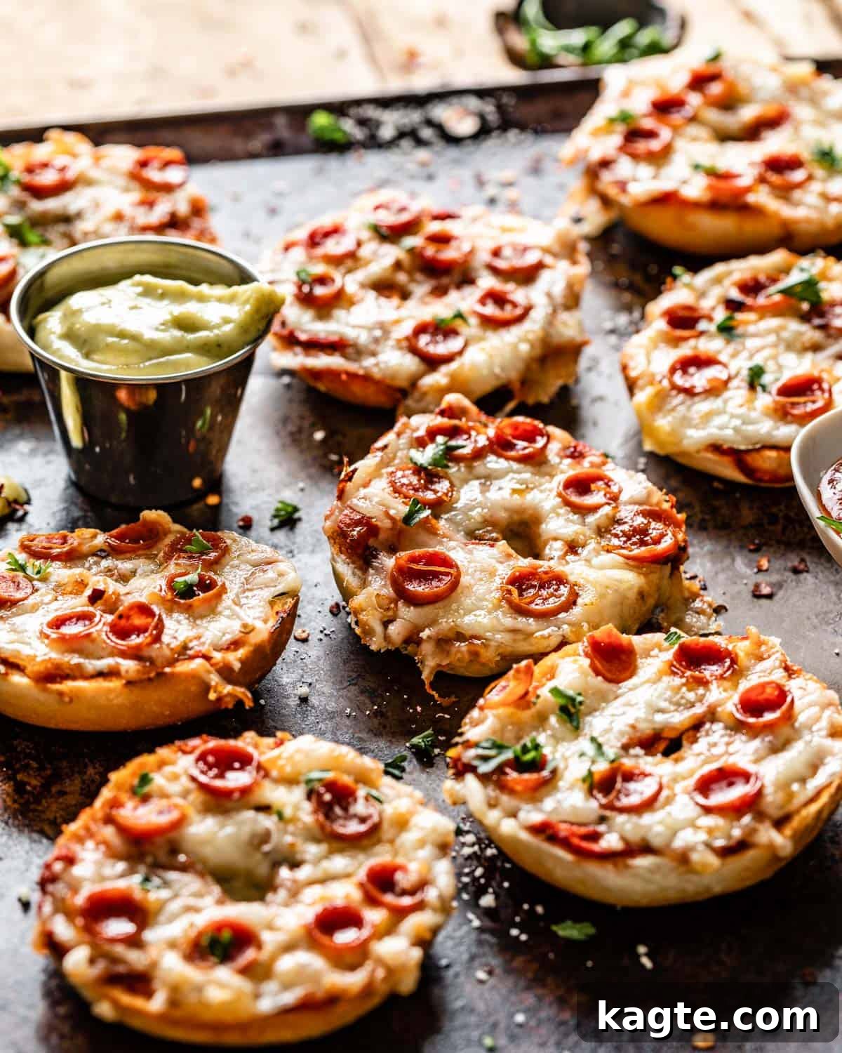 Crispy Air Fryer Bagel Bites Frozen and Fresh 6 Side view of air fryer bagel bites arranged on a serving tray, showcasing their golden-brown edges and melted cheese, emphasizing their appeal as a delicious snack or meal.