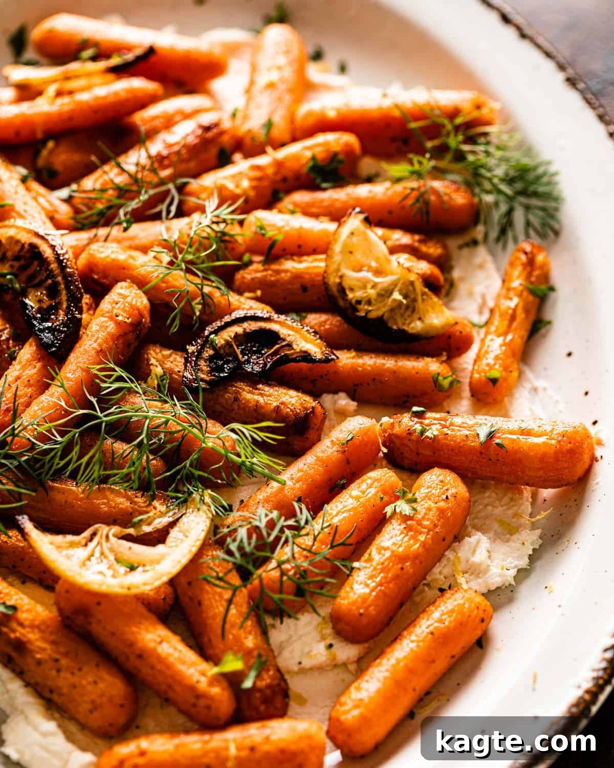 Close-up of perfectly air-fried baby carrots on a plate, showcasing their tender-crisp texture and golden-brown caramelization, ready to be served.