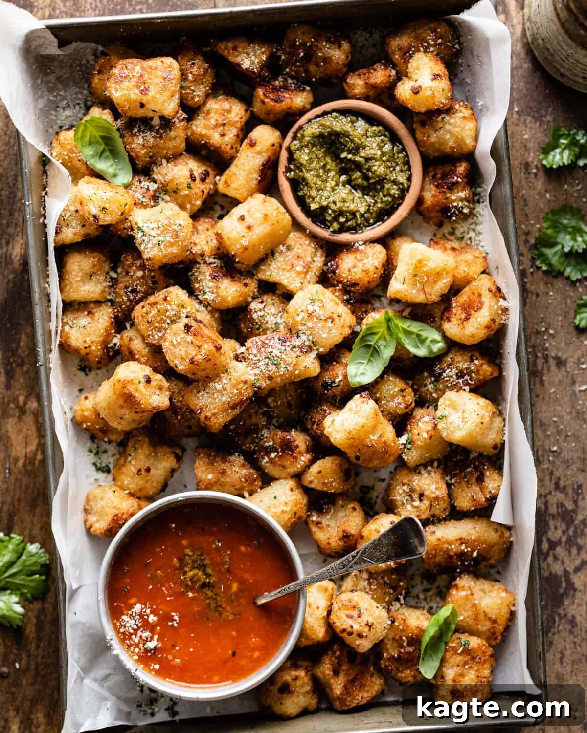 Crispy Trader Joe's Air Fryer Cauliflower Gnocchi served with a vibrant dipping sauce, garnished with fresh herbs.
