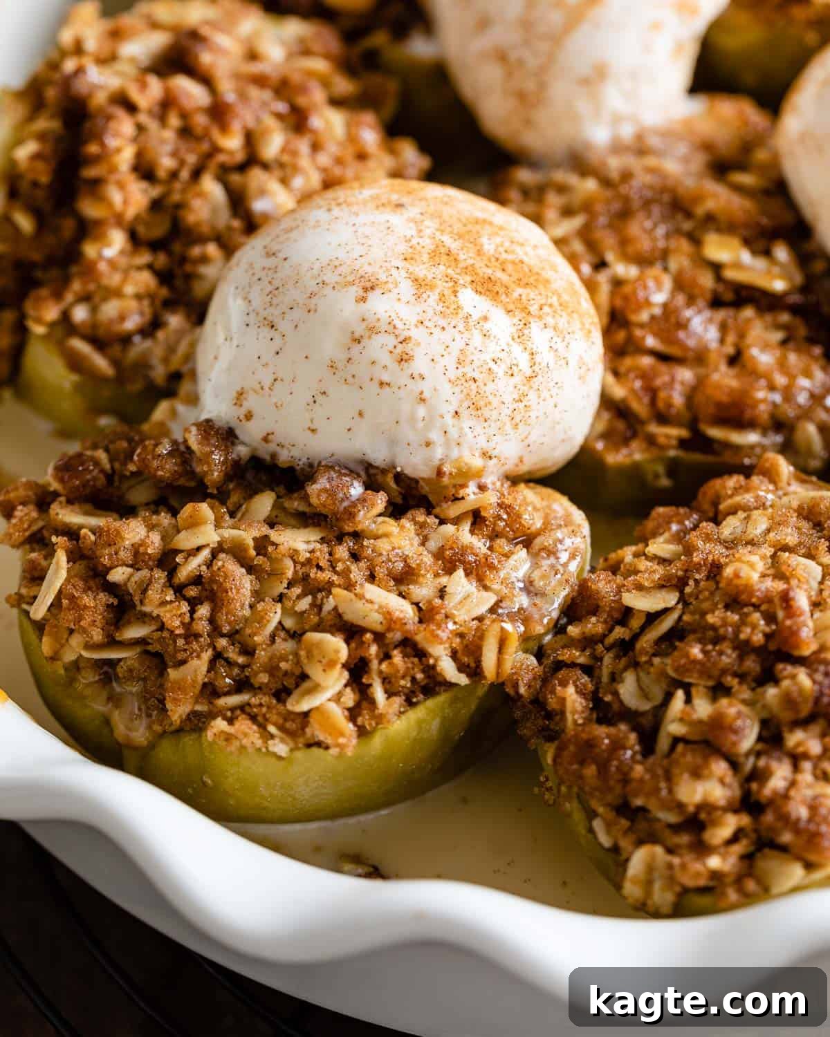 Air Fryer Apple Oat Crumble 7 Up close image of air fryer apples with ice cream.
