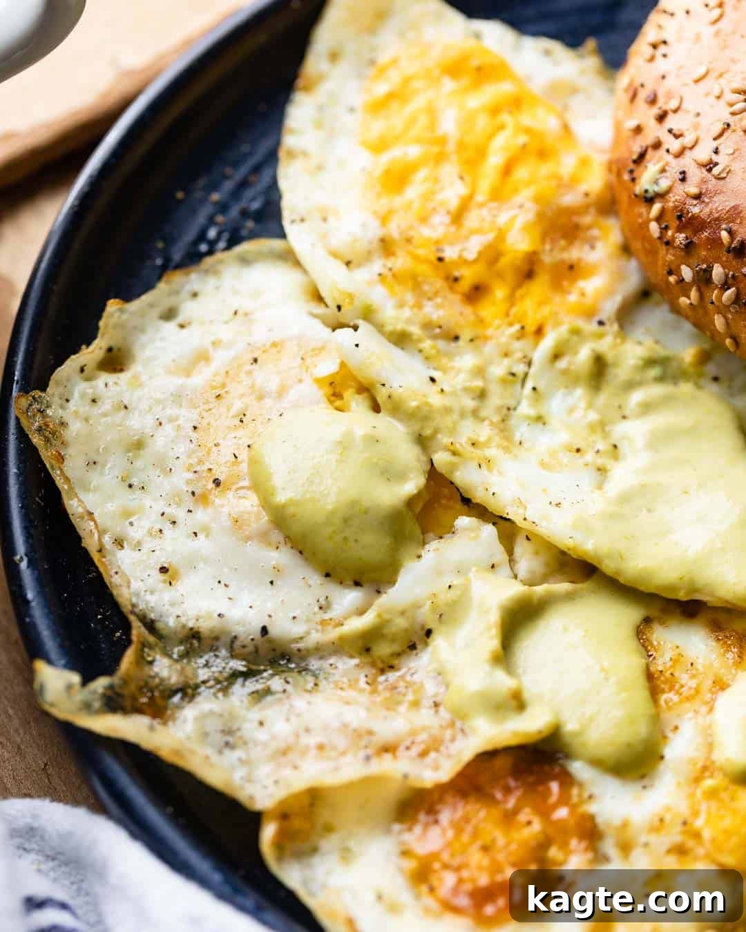 Solid Gold Yolks 6 Two perfectly cooked over hard eggs served with a drizzle of hot sauce, ready to be enjoyed as a versatile and delicious meal.