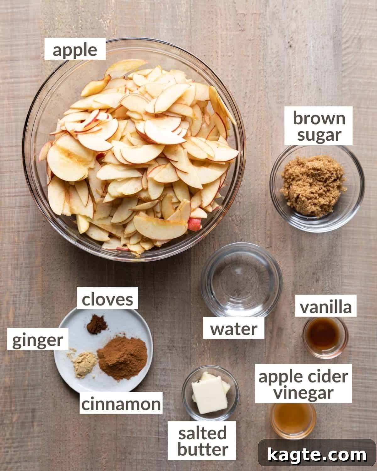 Luscious Apple Curd 3 All of the ingredients needed to make apple curd in glass prep bowls, including sliced apples, brown sugar, cinnamon, butter, and apple cider vinegar.