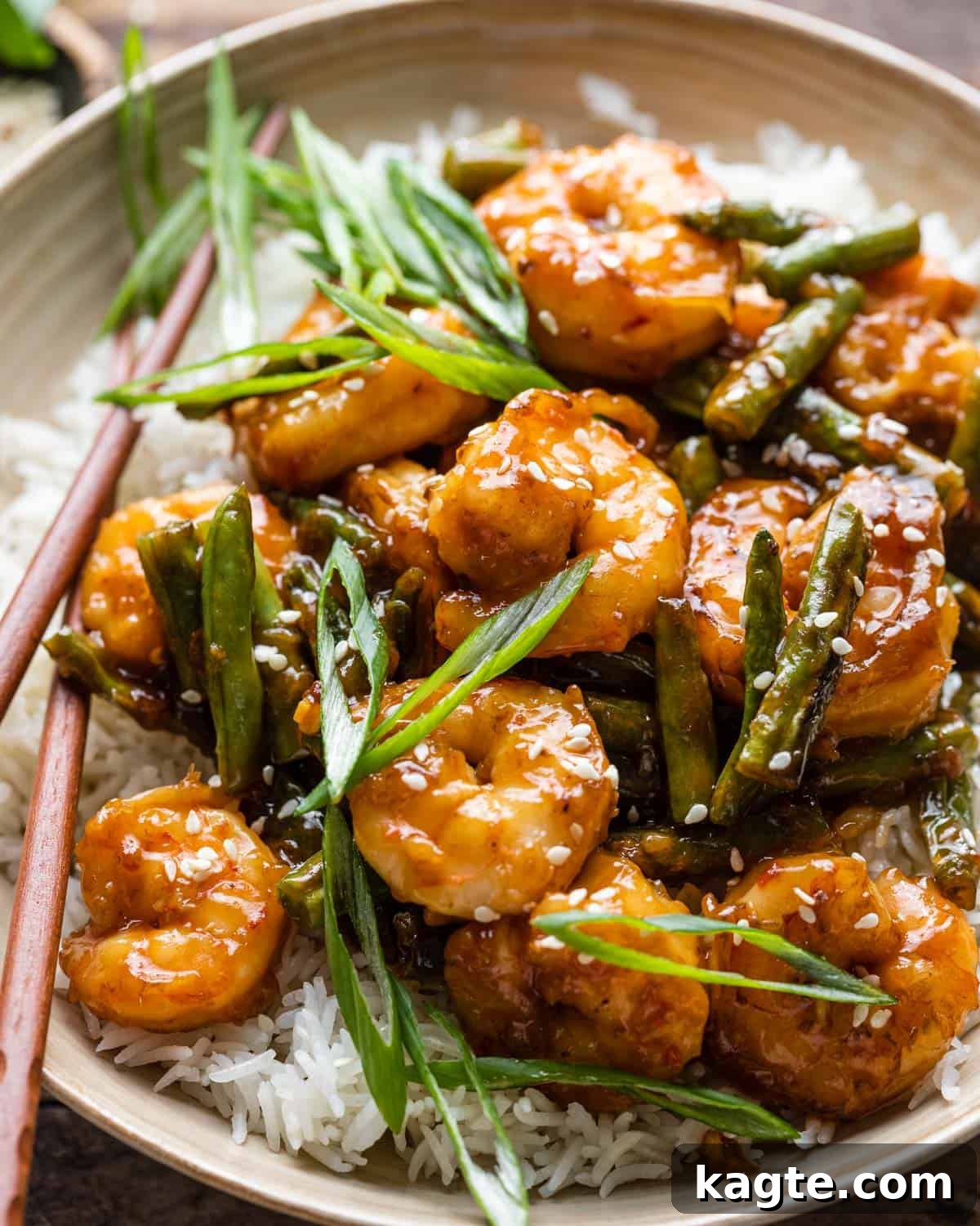 Close up of shrimp over rice in a bowl. 