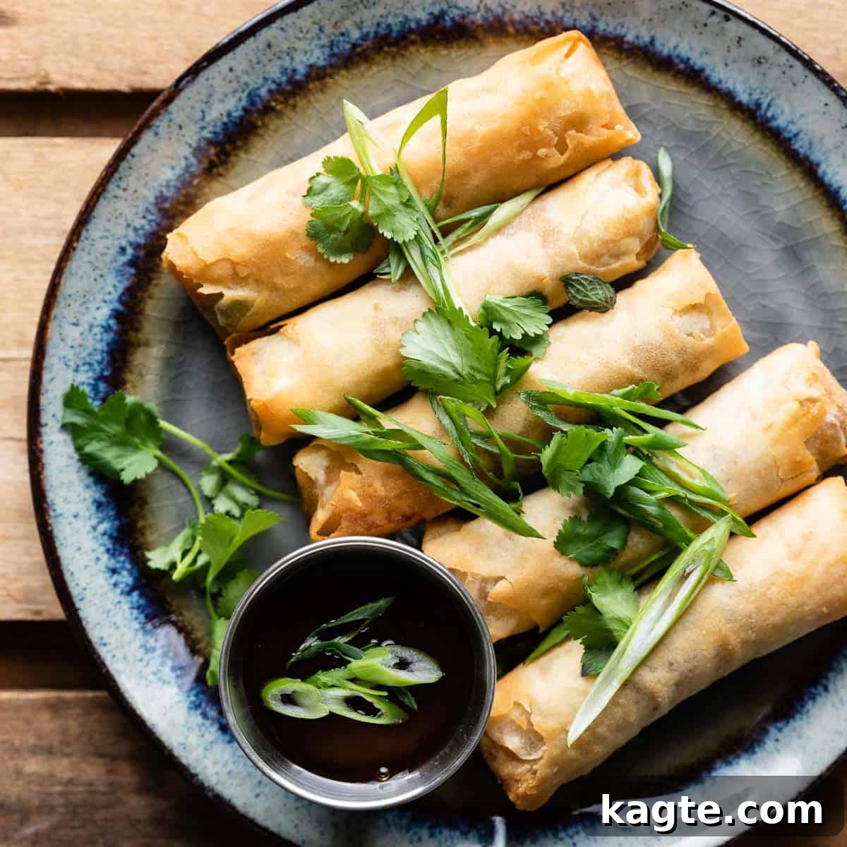 Egg Rolls or Spring Rolls: The Great Debate 3 Spring rolls on a plate, showcasing their fresh ingredients and translucent wrappers.