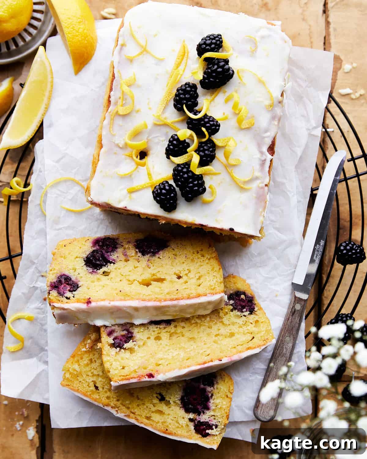 Sliced blackberry lemon bread on a cooling rack.