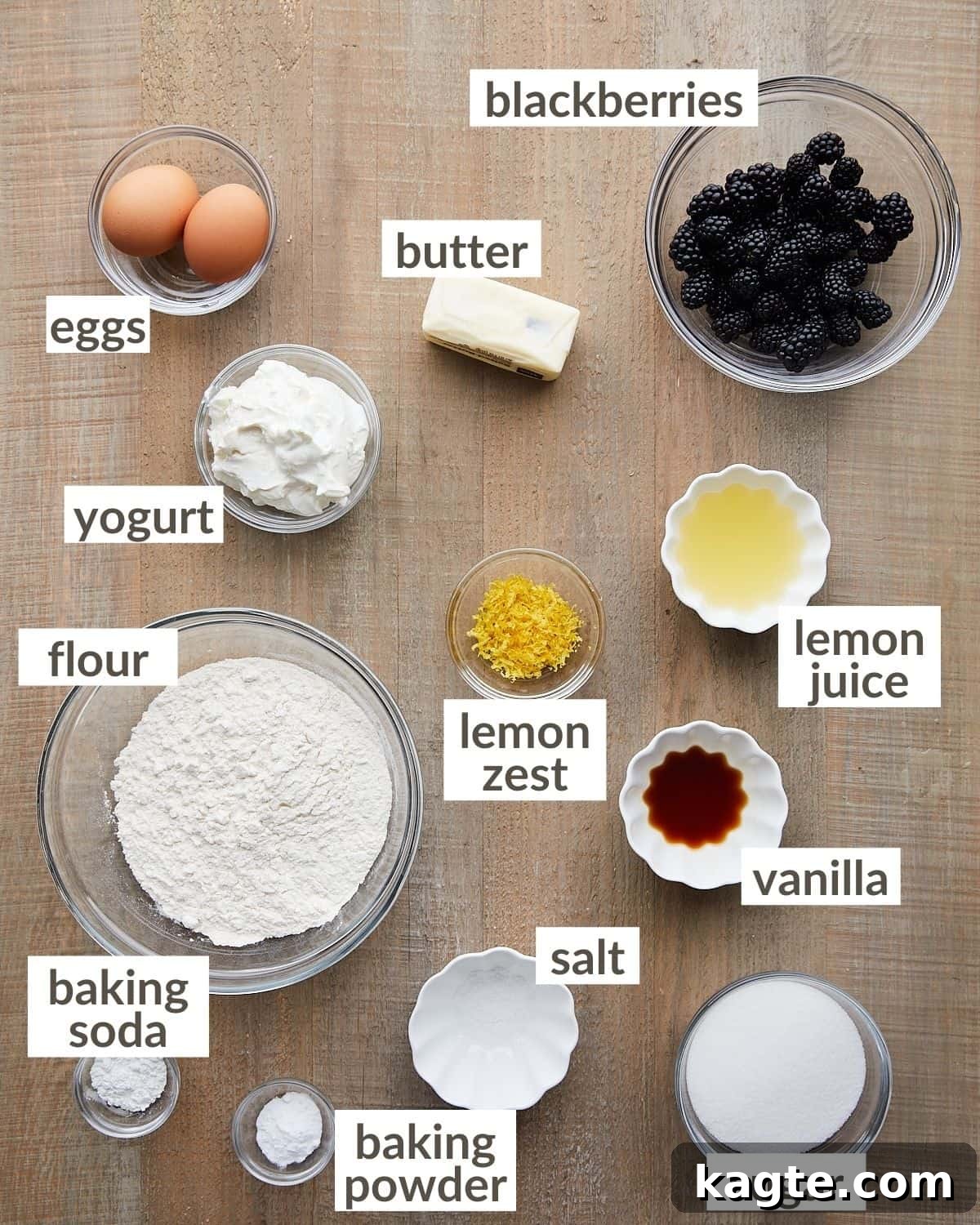 Overhead shot of ingredients in bowls to make blackberry lemon bread loaf.