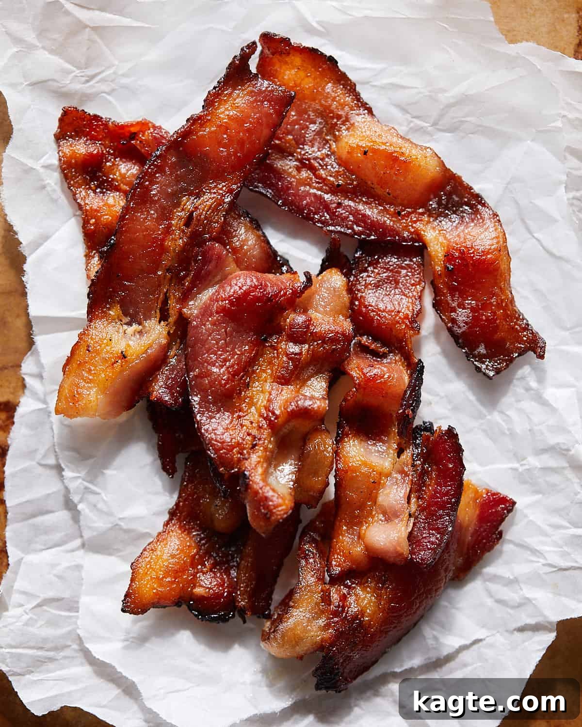 Crispy Instant Pot Bacon 2 Crispy Instant Pot bacon pieces artfully arranged on parchment paper.