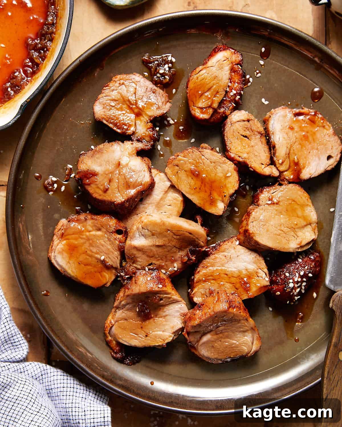 Roasted pork tenderloin sliced with honey soy glaze.