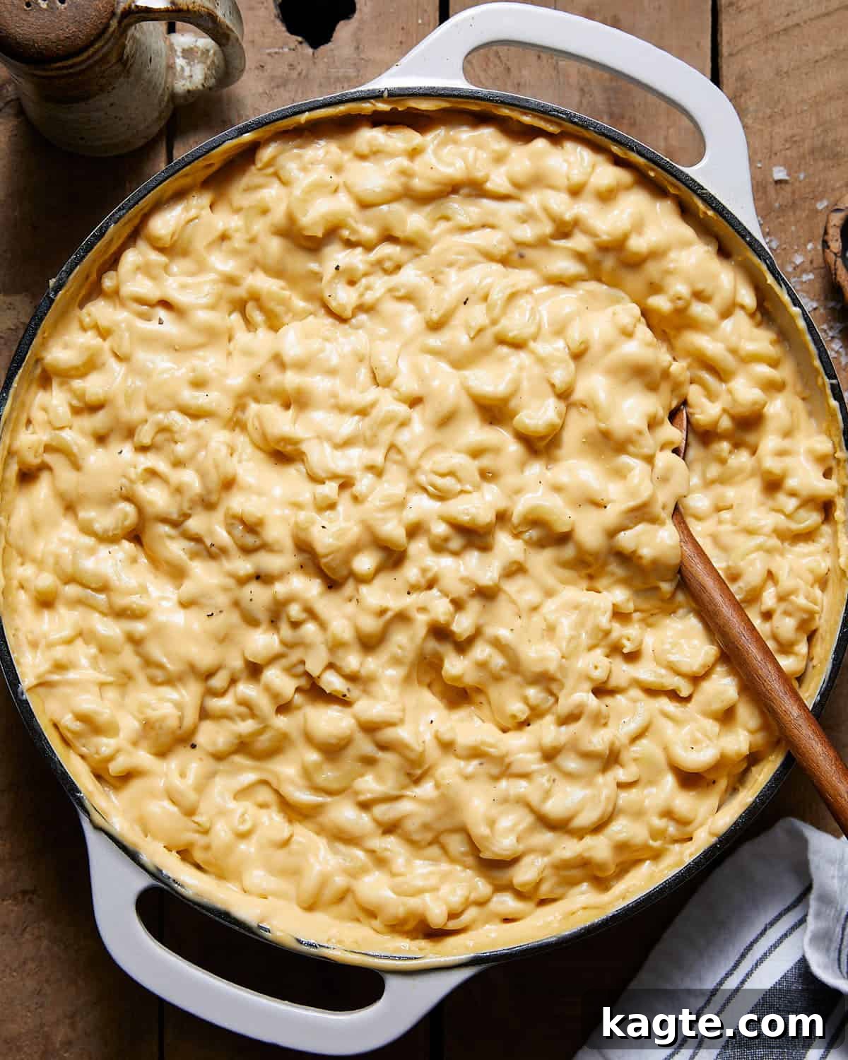 Rich and Creamy Homemade Mac and Cheese Sauce 2 Creamy homemade mac and cheese sauce tossed with pasta in a white pot, ready to serve.