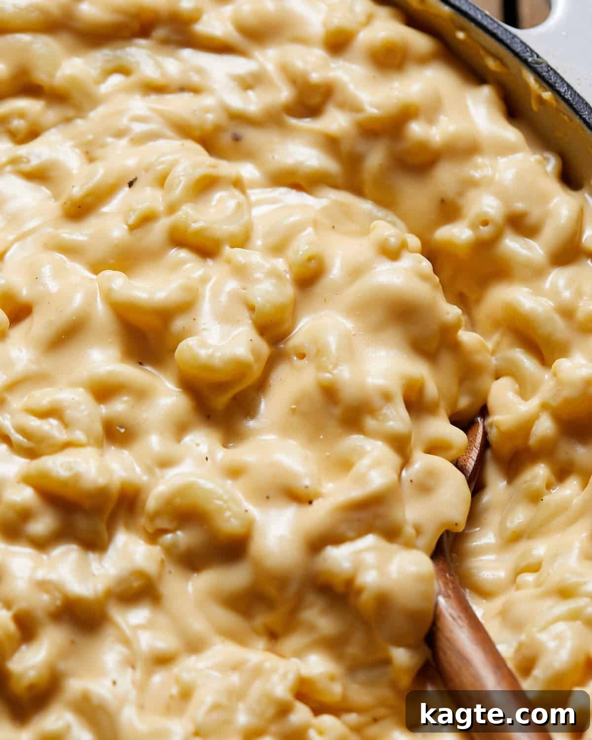 Rich and Creamy Homemade Mac and Cheese Sauce 7 A spoonful of creamy mac and cheese, highlighting the rich, smooth texture of the homemade sauce.