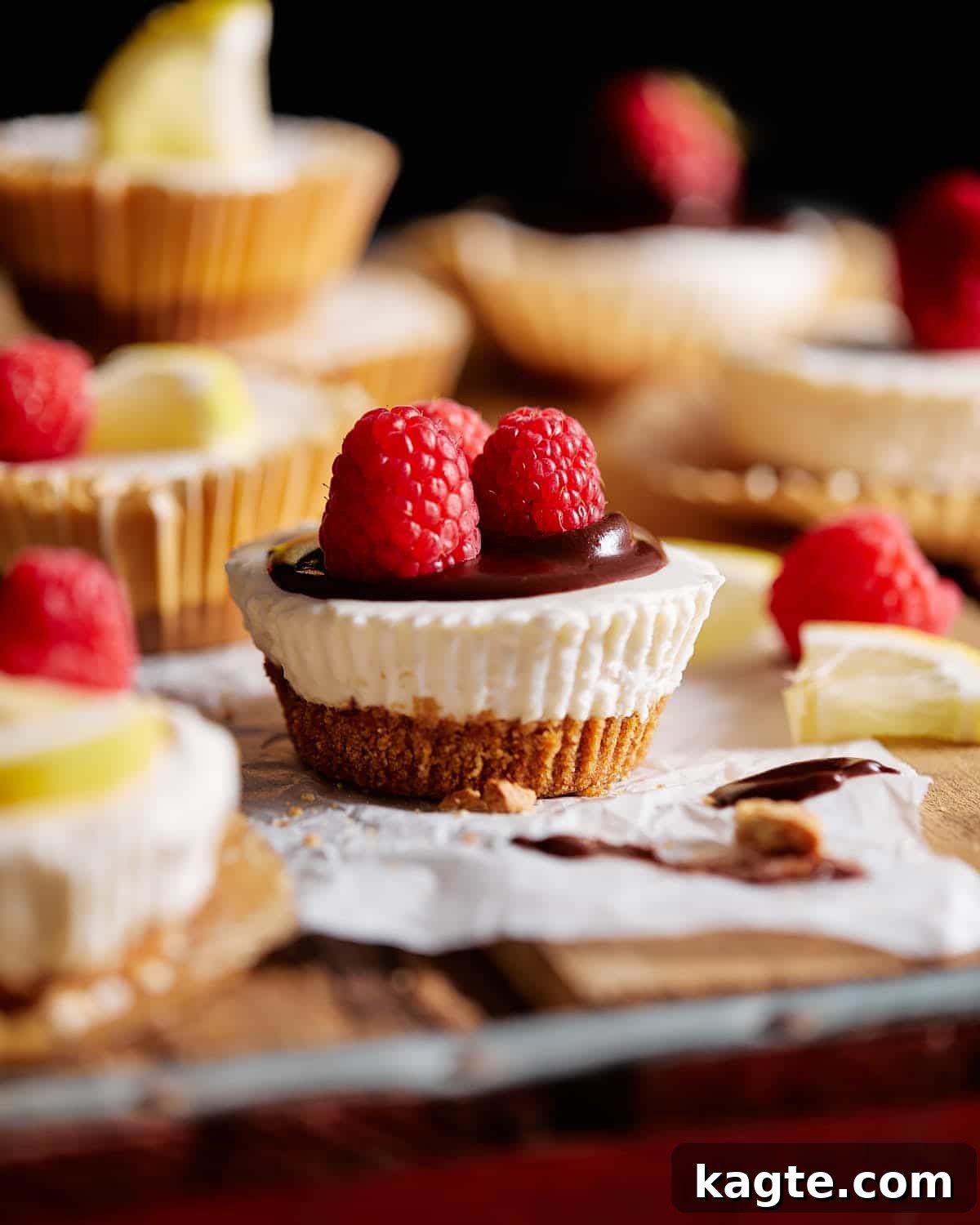Simple No-Bake Mini Cheesecakes 7 No bake mini cheesecakes stacked with a variety of toppings like chocolate and berries.
