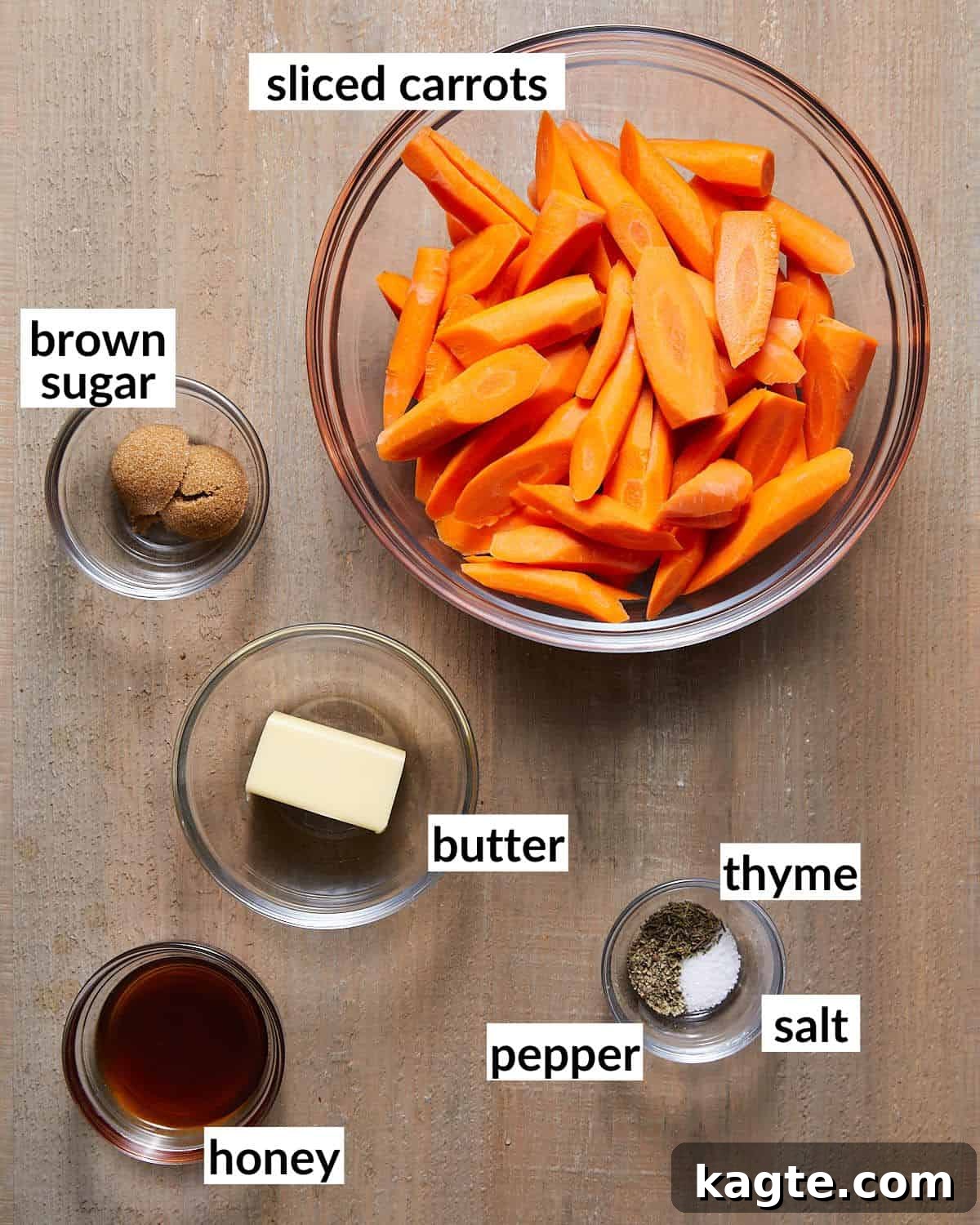 Sticky Sweet Honey Brown Sugar Carrots 3 Essential ingredients laid out for making brown sugar honey glazed carrots: carrots, butter, brown sugar, honey, and spices.