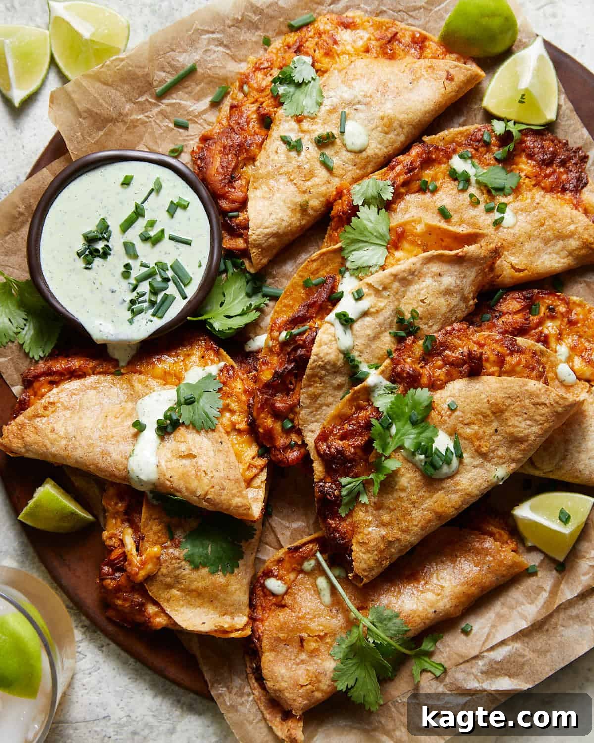 Air fryer buffalo chicken tacos on plate with homemade ranch.