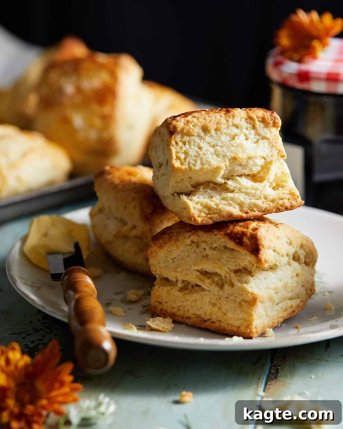 Quick and Buttery Homemade Biscuits 2 From scratch biscuits stacked on top of each other.
