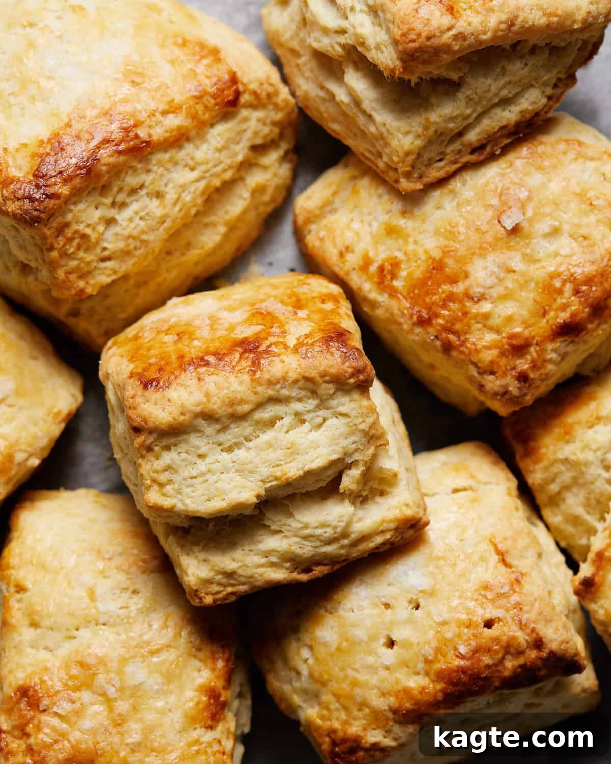Quick and Buttery Homemade Biscuits 6 Easy homemade biscuits stacked up on baking sheet.