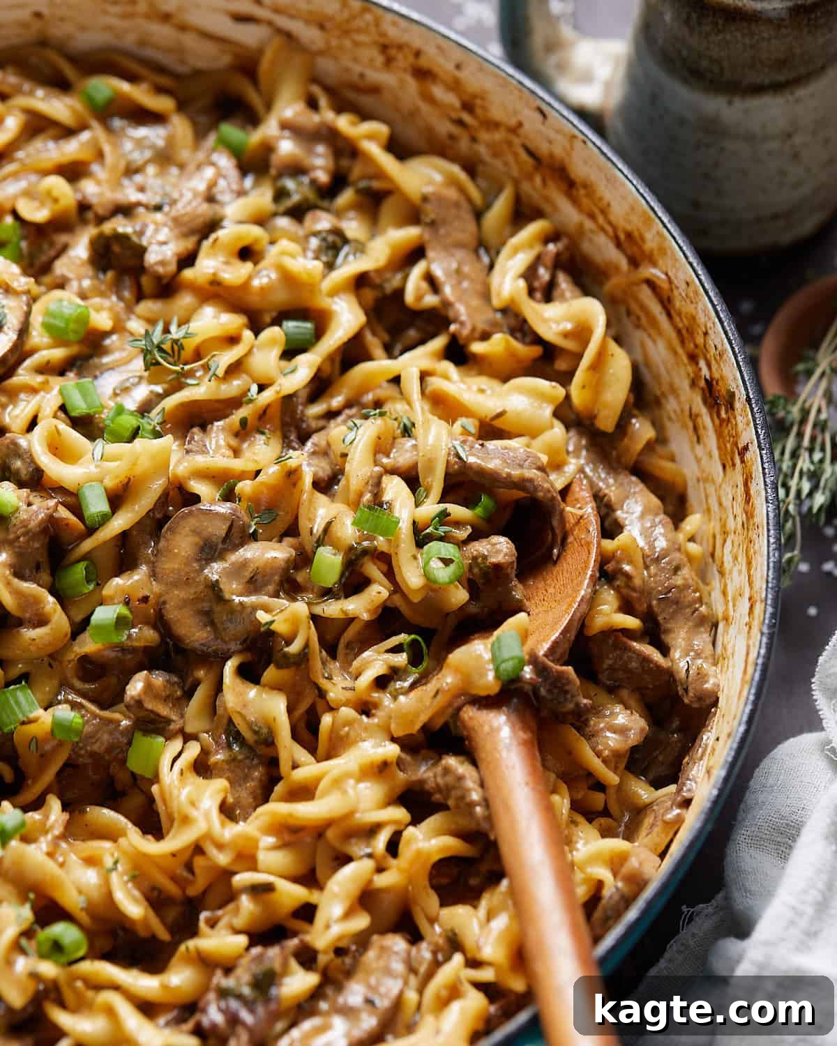 Close up image of healthy beef stroganoff with fresh parsley garnish, ready to eat.
