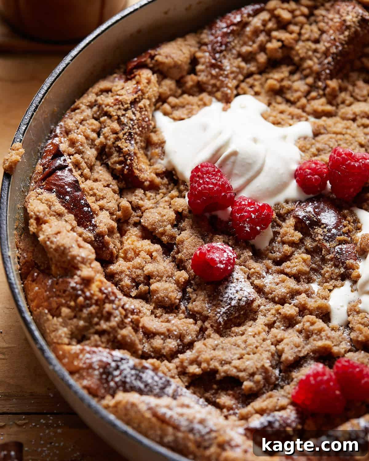 Ultimate Brioche French Toast Bake 6 Up close image of brioche french toast casserole with raspberry topping.