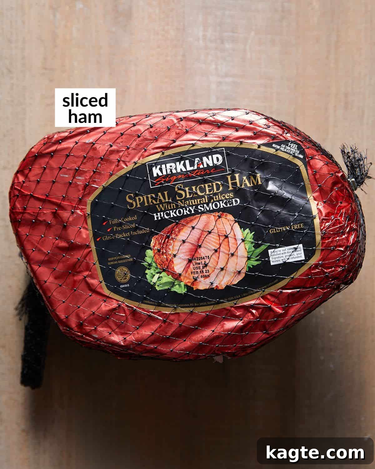Your Go-To Recipe for Juicy Spiral Ham 3 A simple array of ingredients for cooking spiral ham, including the ham itself, chicken broth, and glaze components.