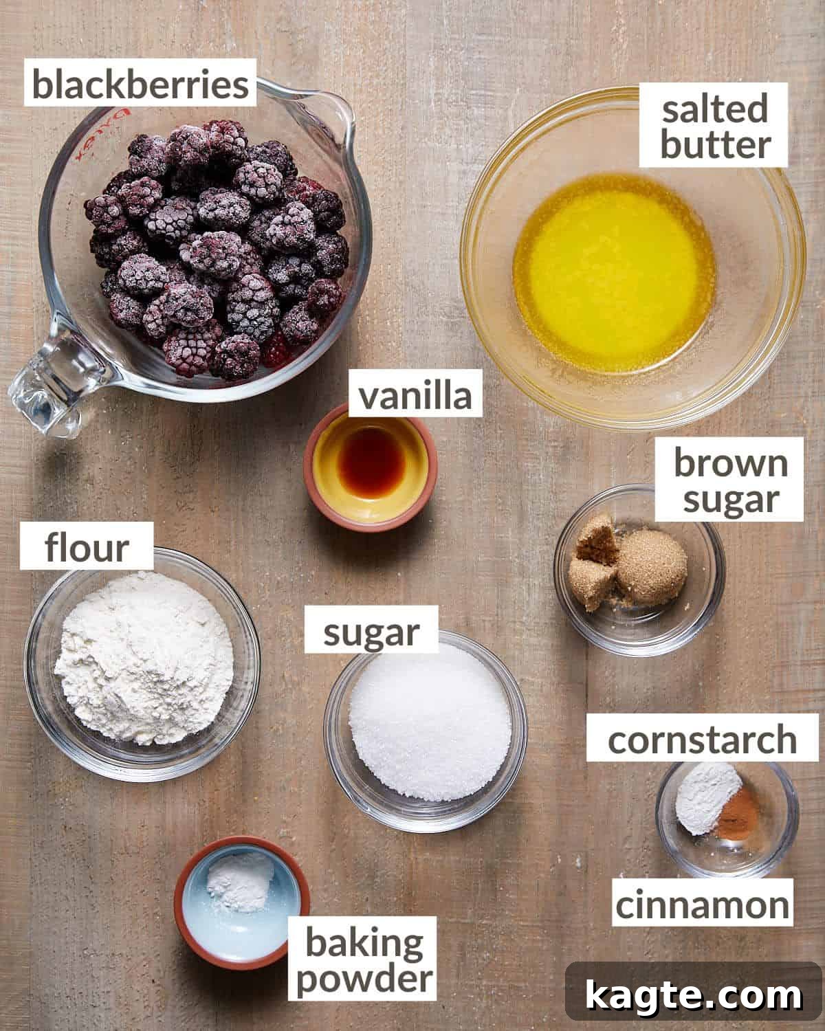 Overhead image displaying all the fresh and simple ingredients required for Air Fryer Blackberry Cobbler, laid out on a light surface.