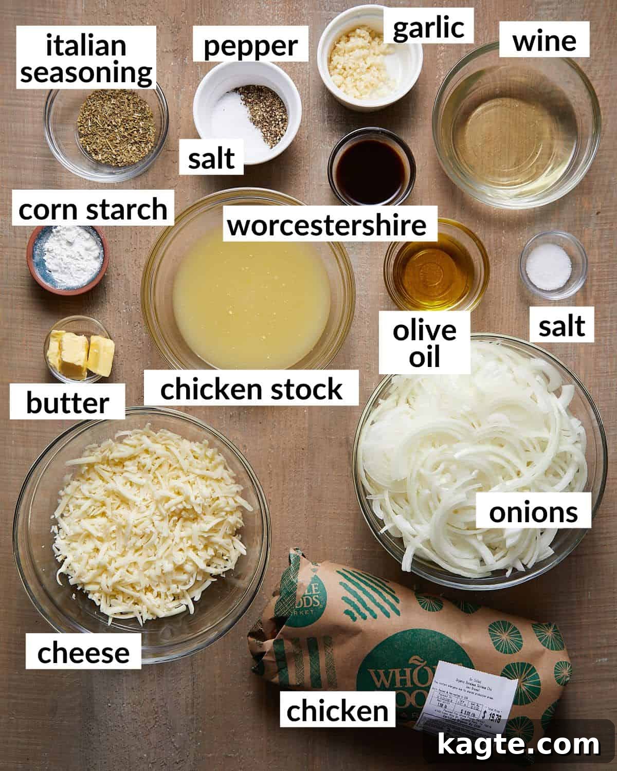 Caramelized Onion and Gruyère Chicken Bake 3 Overhead image displaying all the fresh ingredients required to prepare French onion chicken bake, neatly arranged on a rustic surface.