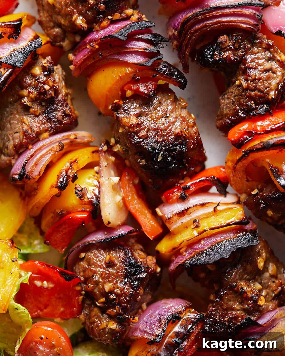 Tender Oven-Baked Beef Skewers 5 Up close image of beef kabobs.