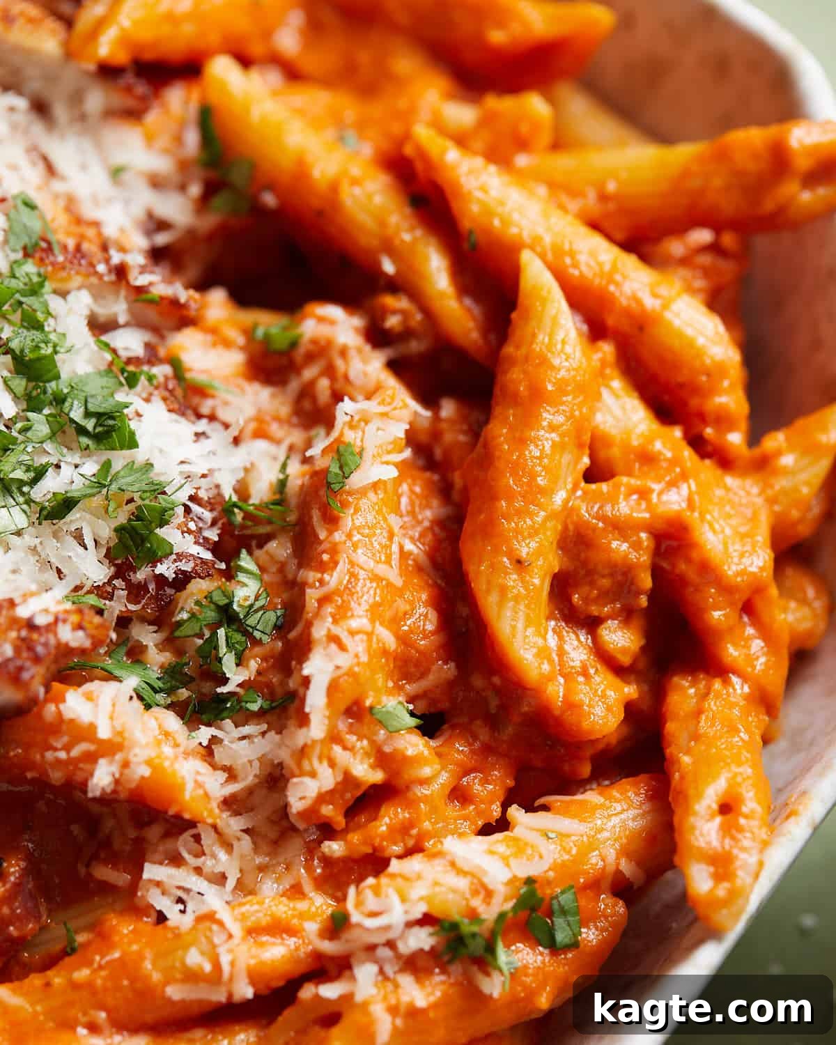 Overhead up close image of penne alla vodka with chicken. 