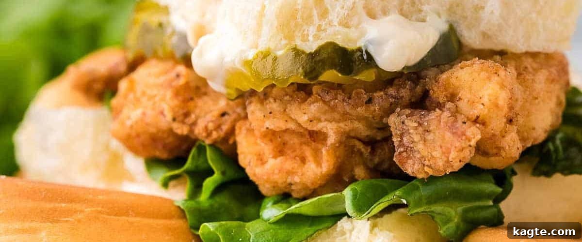 25 Hassle-Free Boneless Chicken Thigh Ideas 16 Crispy fried chicken sliders, neatly arranged with lettuce and pickles.