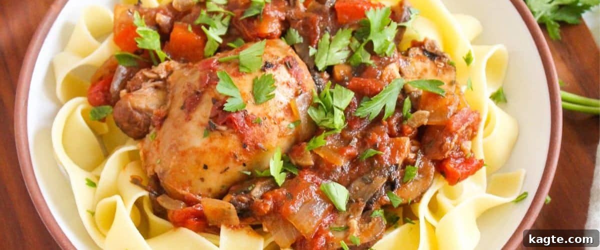 25 Hassle-Free Boneless Chicken Thigh Ideas 18 Hearty slow cooker chicken cacciatore, garnished with fresh herbs.