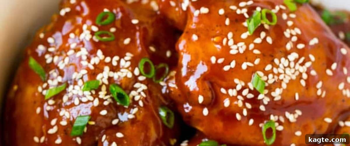 25 Hassle-Free Boneless Chicken Thigh Ideas 20 Succulent slow cooker chicken thighs, beautifully presented with a sprinkle of fresh garnish.