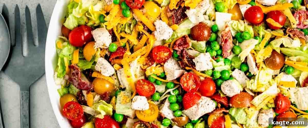 25 Hassle-Free Boneless Chicken Thigh Ideas 25 A fresh and vibrant chopped salad with chicken, served in a clean white bowl.
