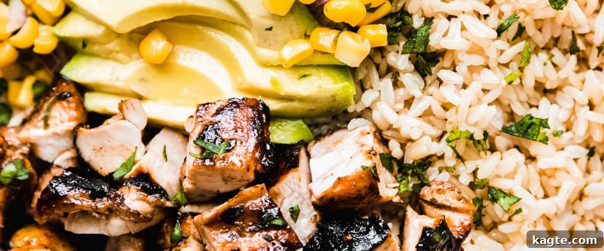 25 Hassle-Free Boneless Chicken Thigh Ideas 27 A vibrant honey chipotle chicken bowl, topped with fresh corn salsa.