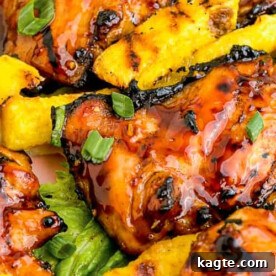 Sweet and savory Huli Huli chicken, adorned with pineapple slices.